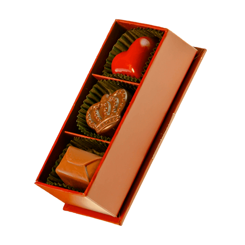 Box of chocolates: heart, crown, and folded-paper-shaped chocolates inside a red rectangular box.