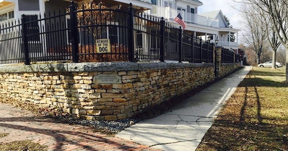 Completed natural stone patio on a Maine residential property