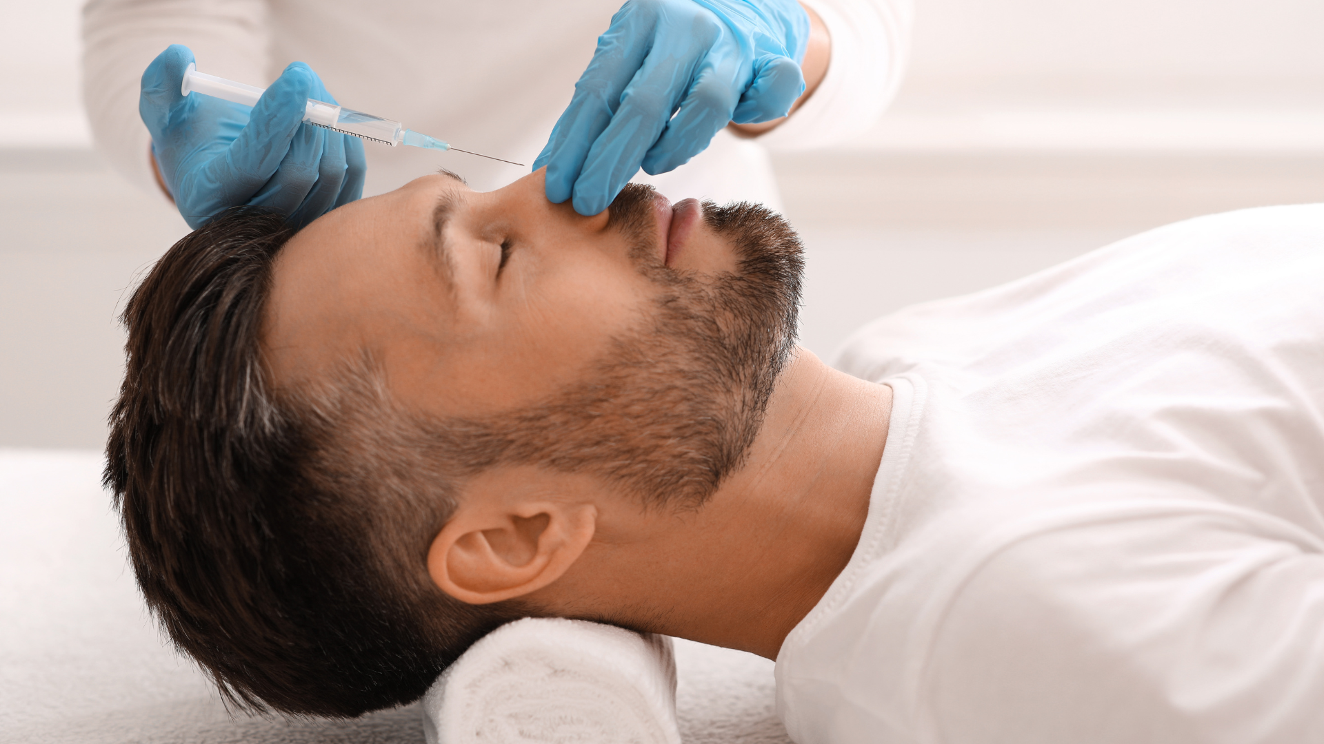 man getting injections on nose