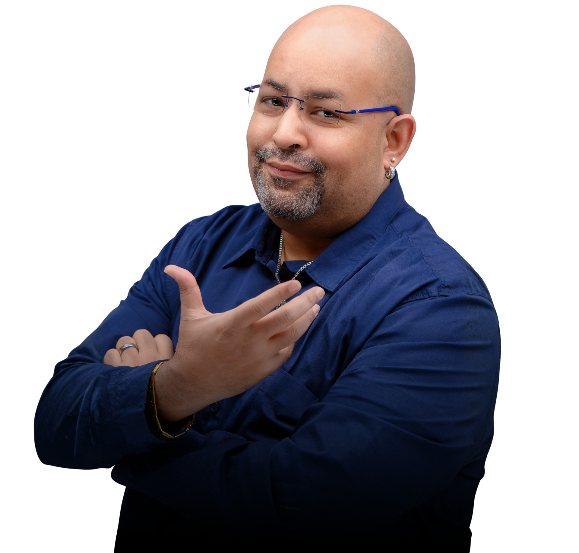 Smiling man in blue shirt and glasses, posing with arms crossed against a white background