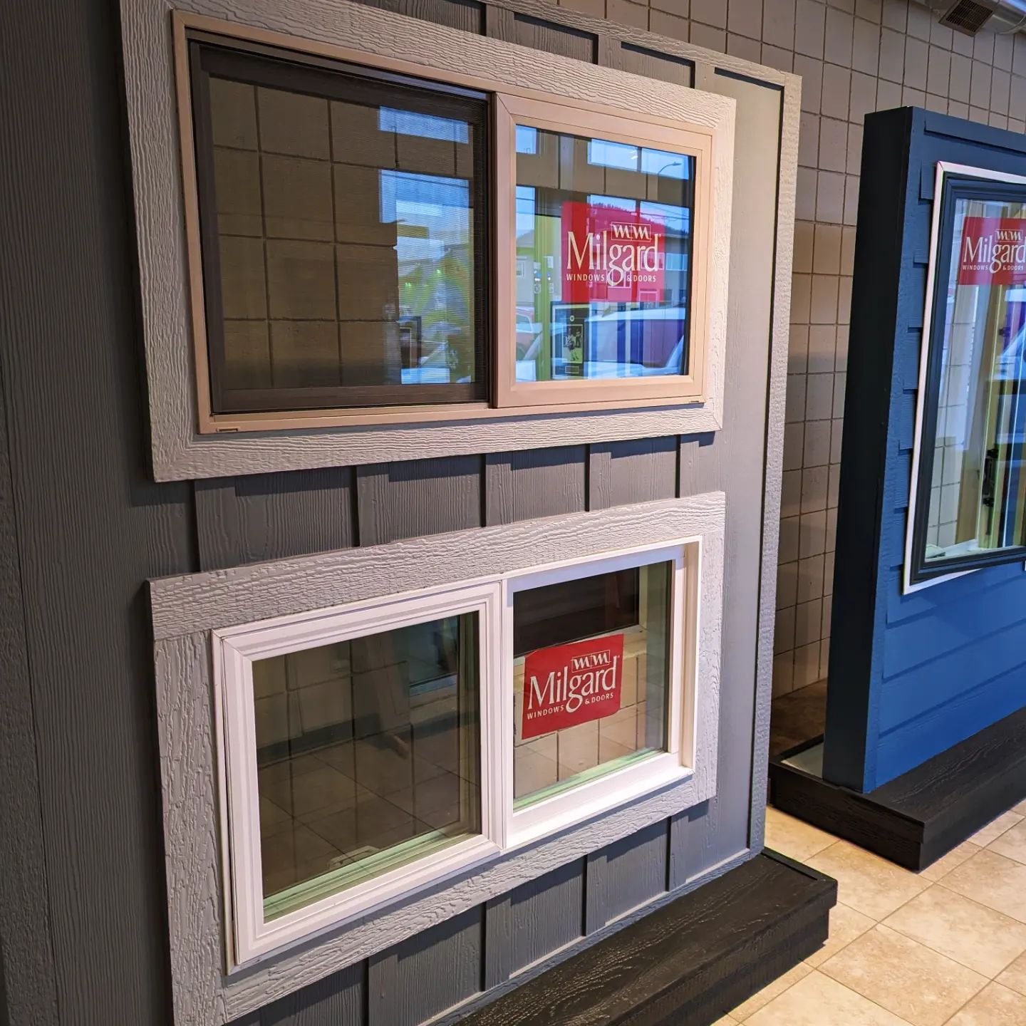 Display showroom featuring several window models with different colored frames.