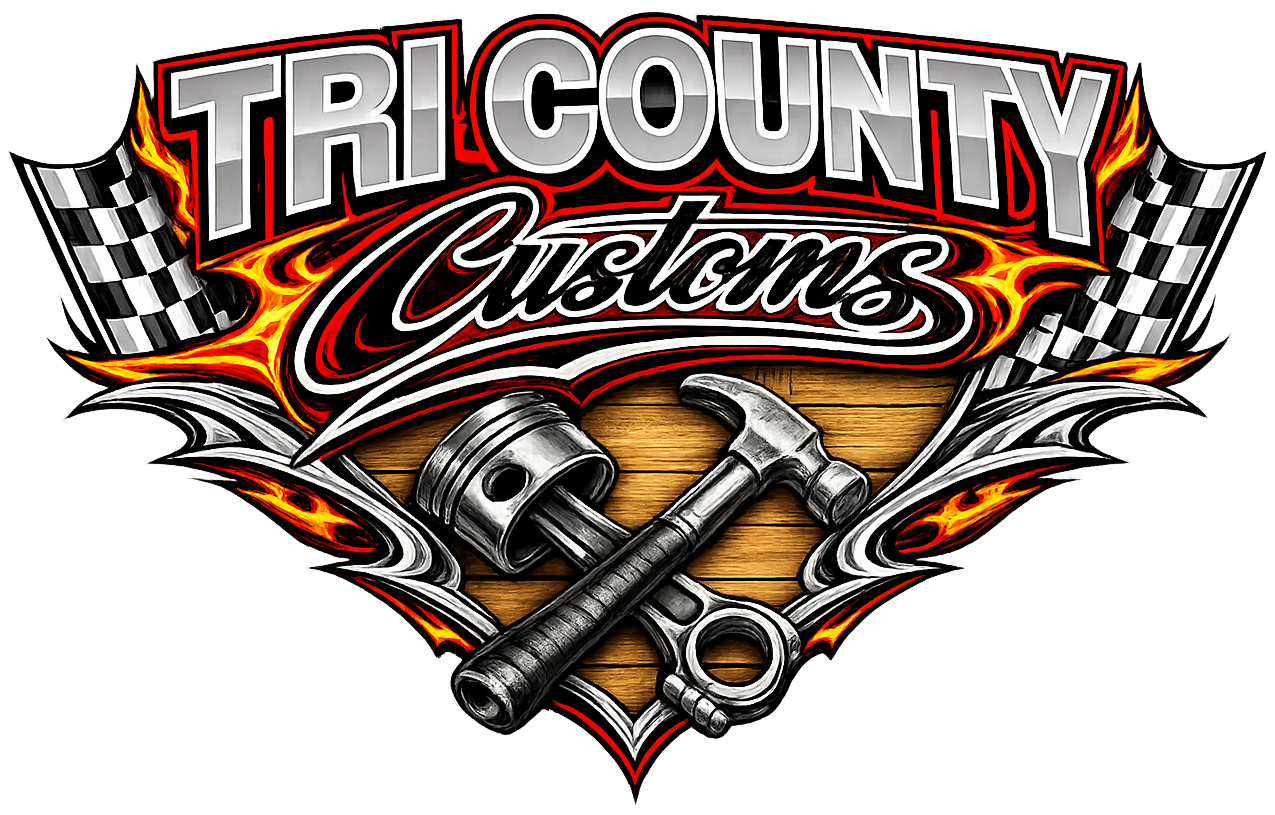 Tri County Customs logo with crossed piston and hammer over red, black, and orange flames