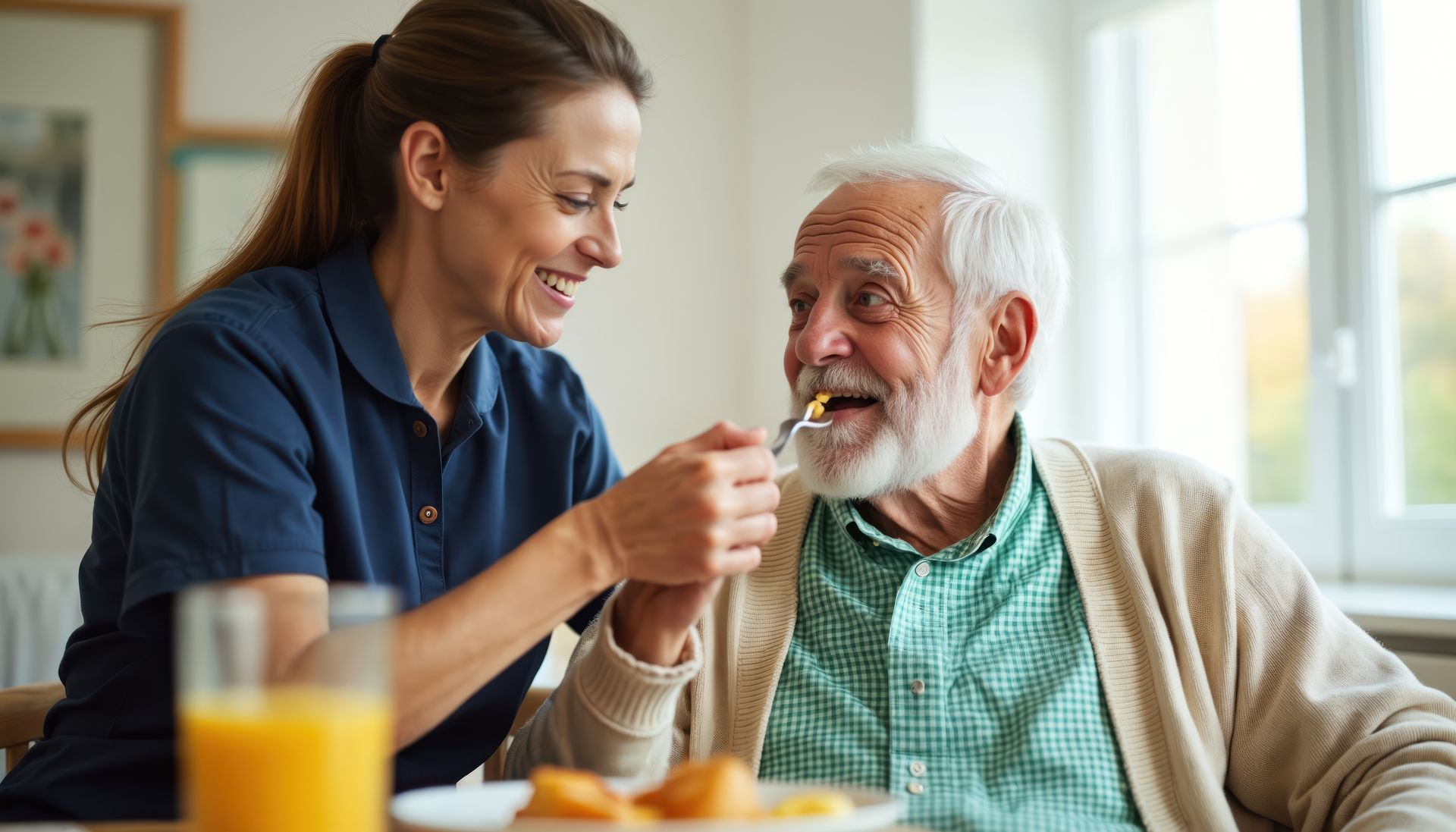A compassionate caregiver gently helping an elderly person at home. A compassionate caregiver gently helping an elderly person at home.