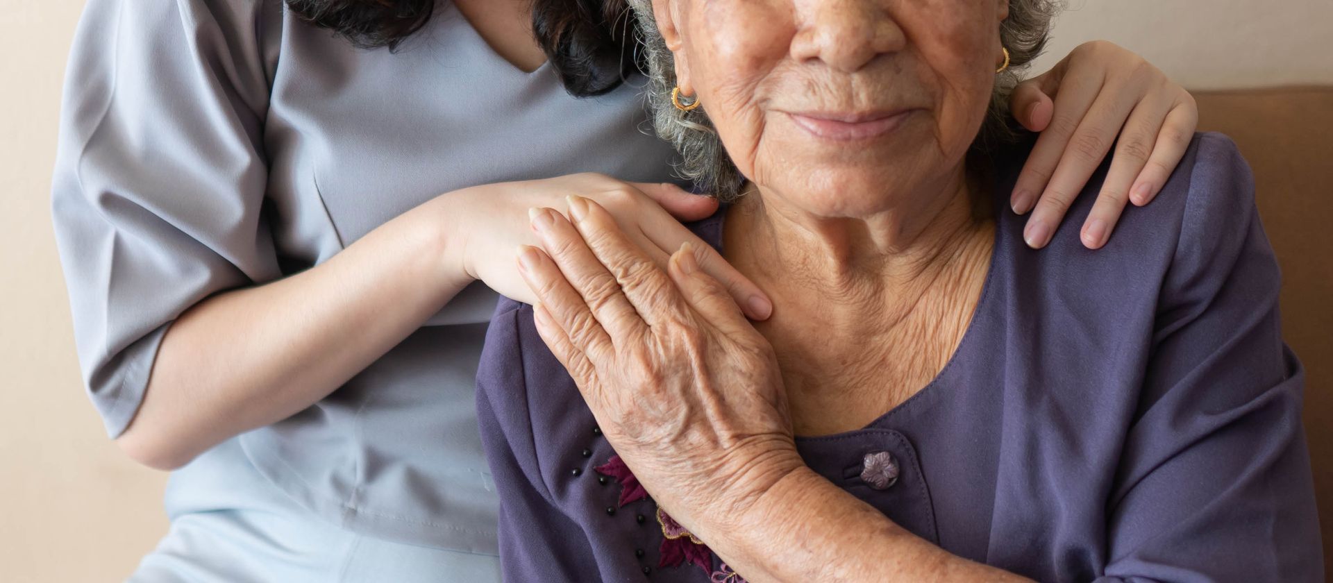 Friendly relationship between caregiver and happy elderly woman. Friendly relationship between caregiver and happy elderly woman.
