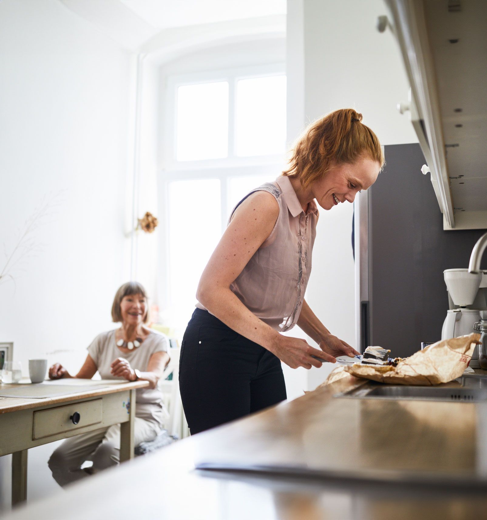 Woman Preparing Food With Elder Woman — Princeton, IN — Friends and Family Caregivers Woman Preparing Food With Elder Woman — Princeton, IN — Friends and Family Caregivers