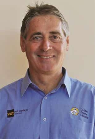 A Man in a Blue Shirt is Smiling for the Camera — Pet Medical Centre in Dubbo, NSW