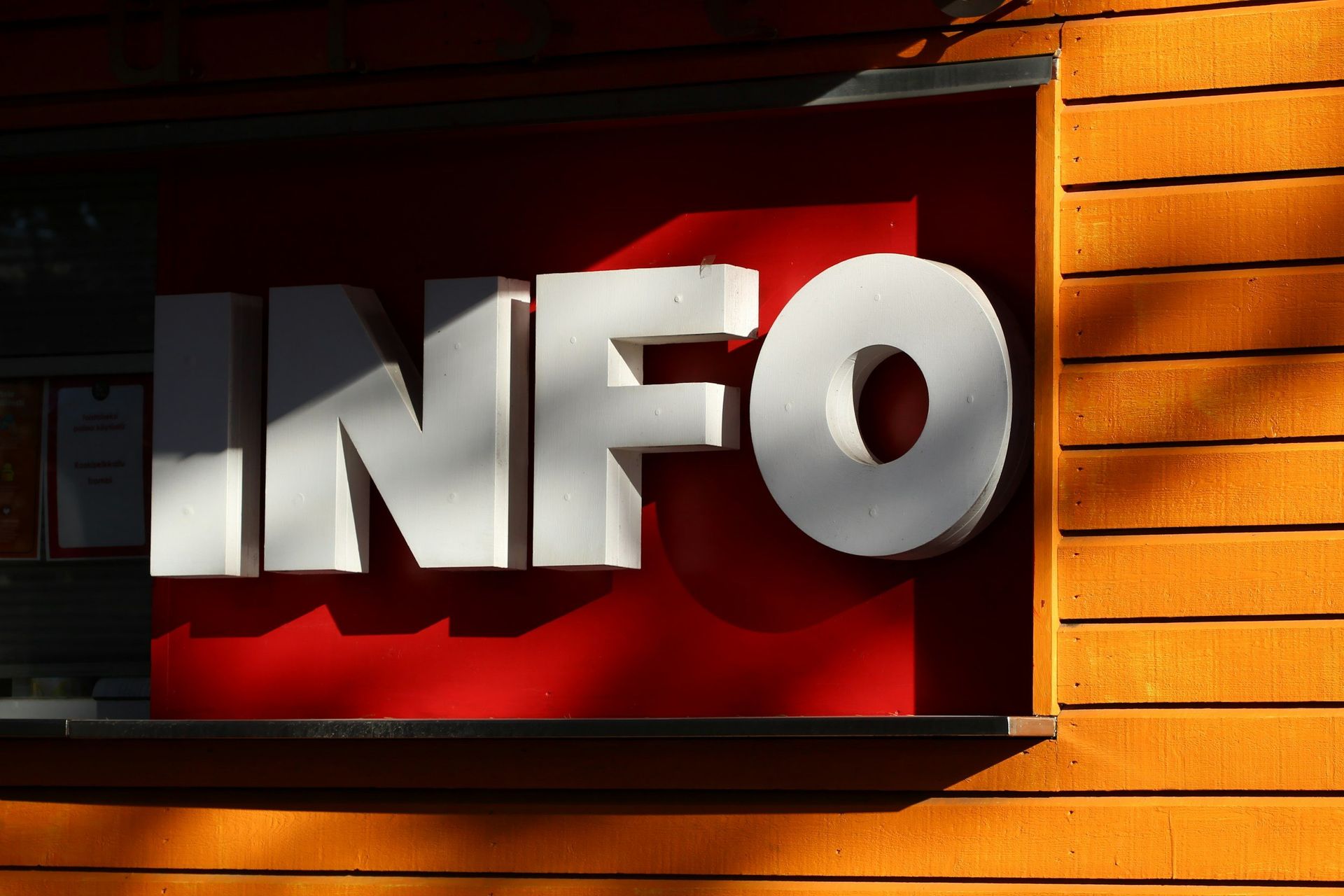 A red sign with the word info on it