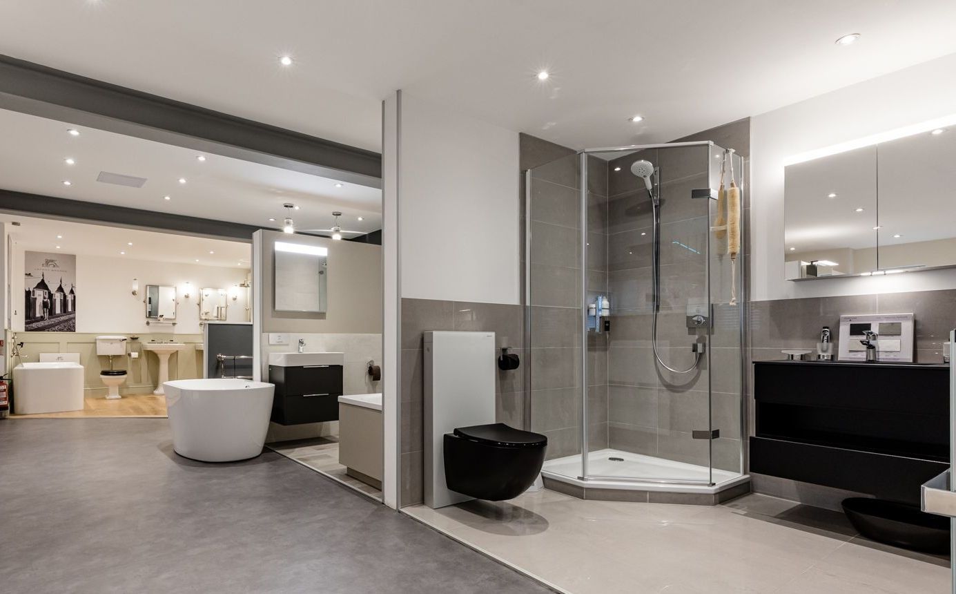 A bathroom with a shower , sink , toilet and bathtub.