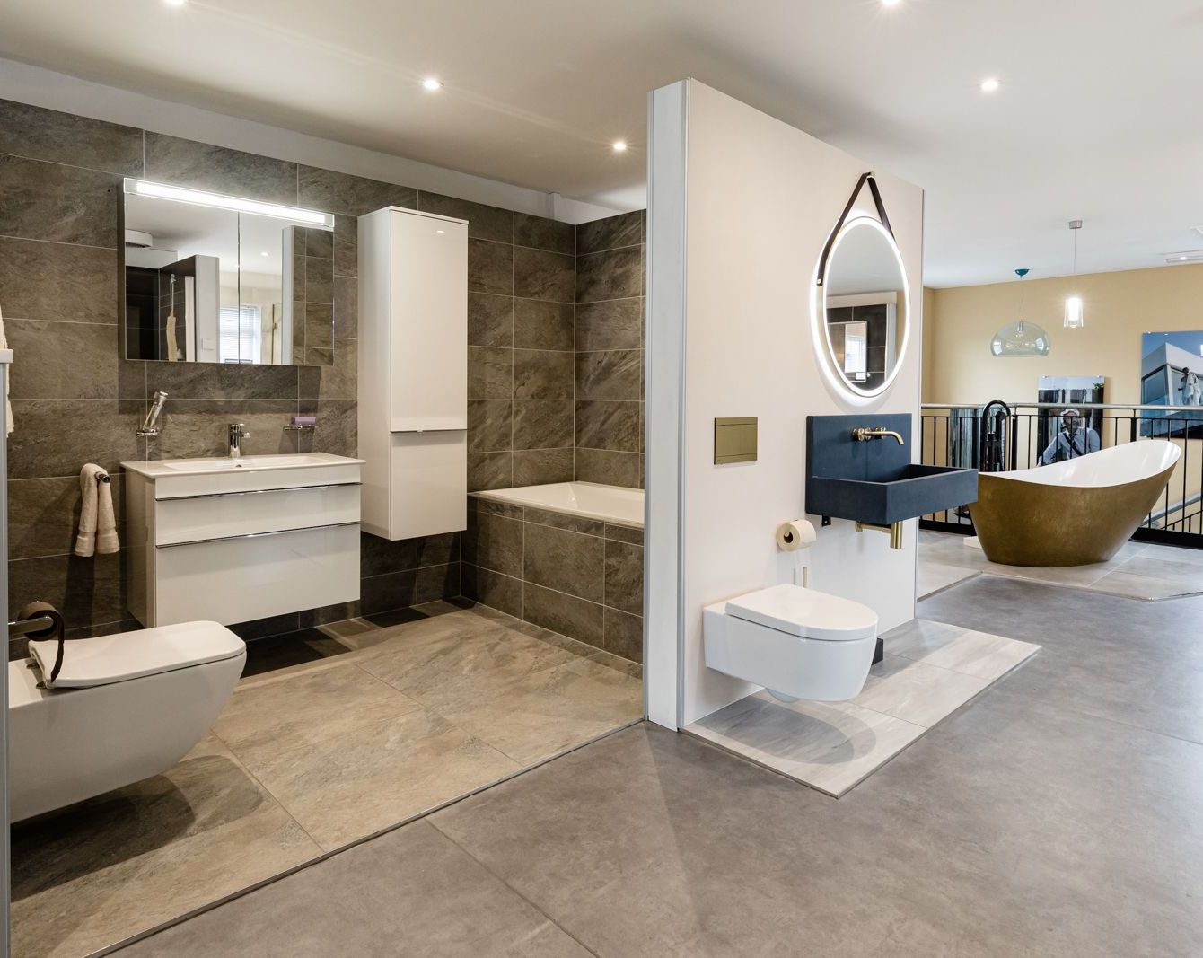A bathroom with a sink , toilet , bathtub and mirror.
