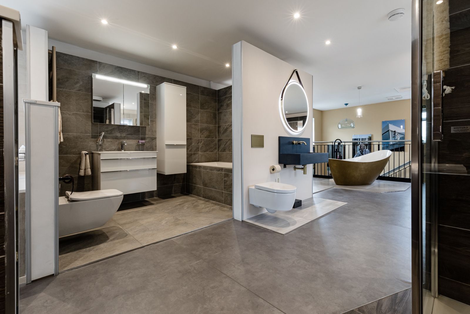 A bathroom with a sink , toilet , bathtub and mirror.