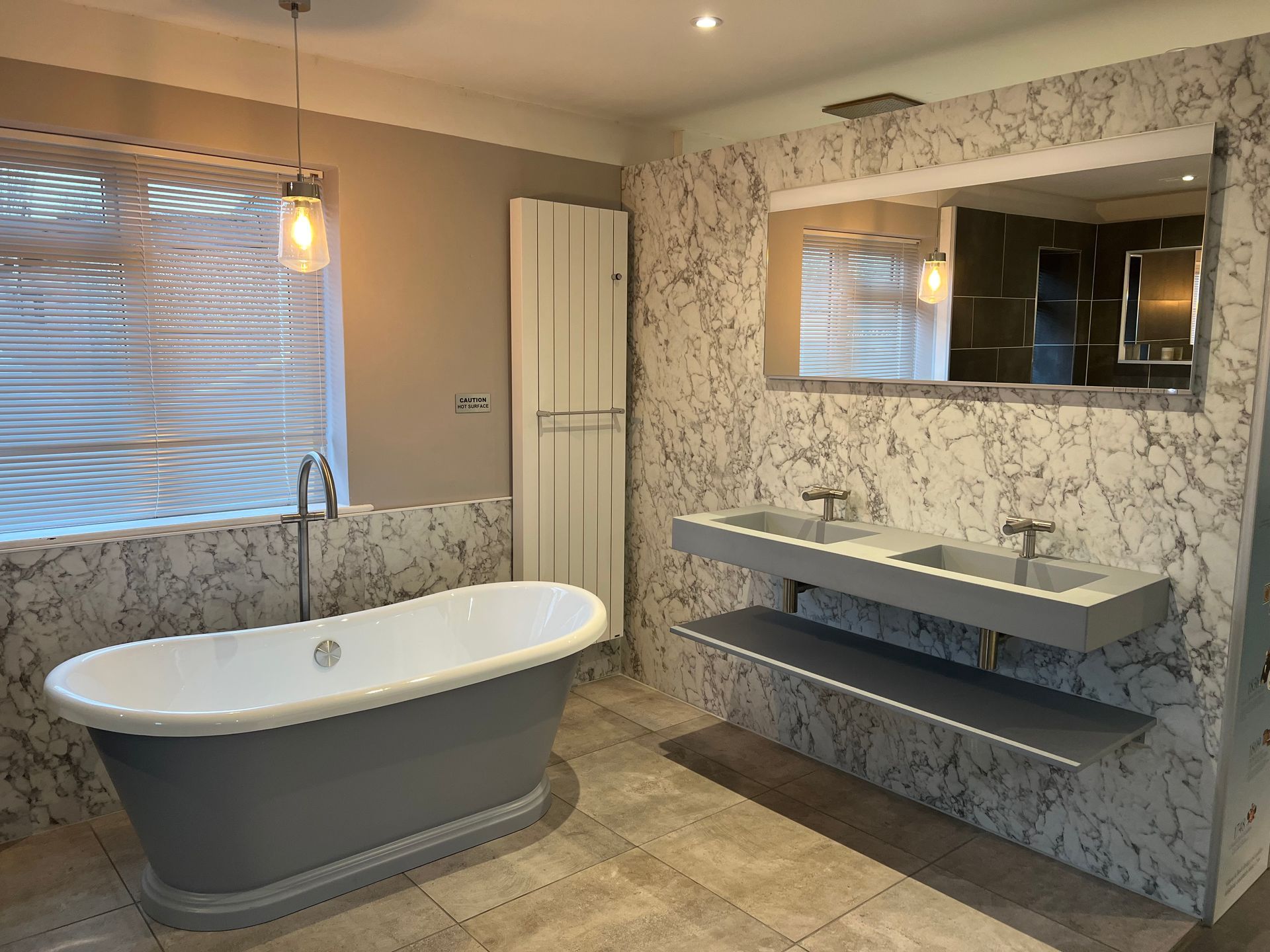 A bathroom with a bathtub and two sinks.