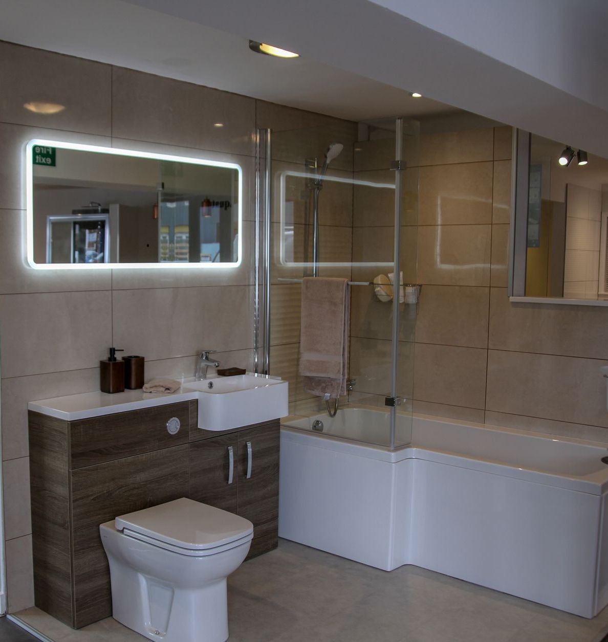 A bathroom with a toilet a sink and a bathtub