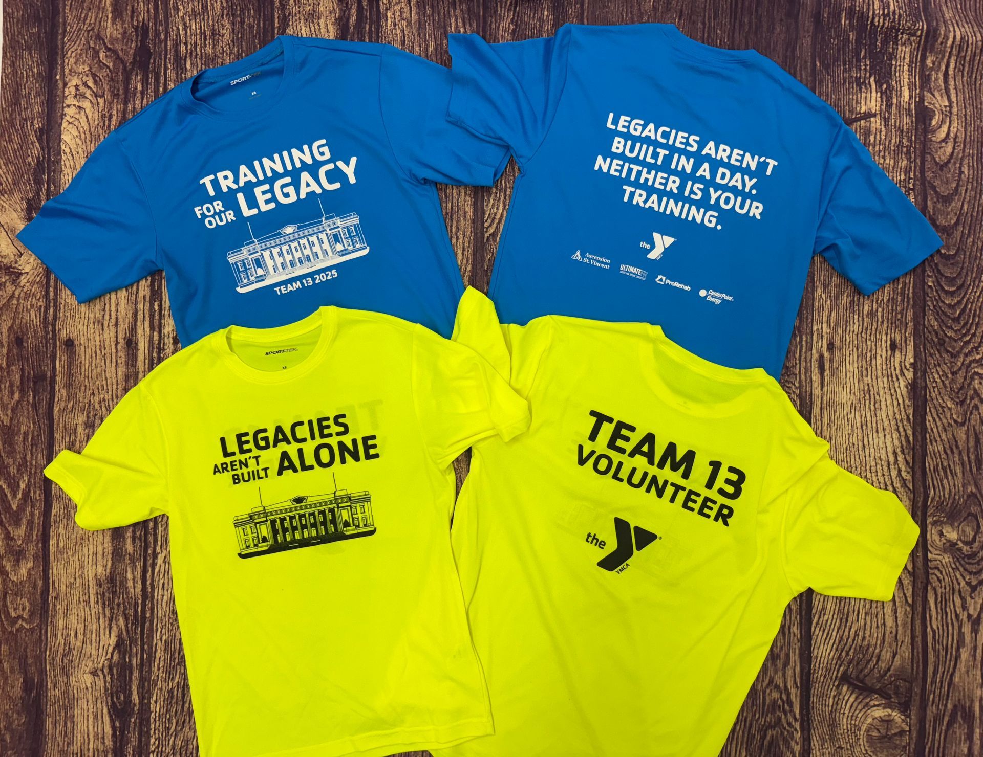 Four t-shirts with one that says team 13 volunteer - Princeton, IN - Make Your Mark
