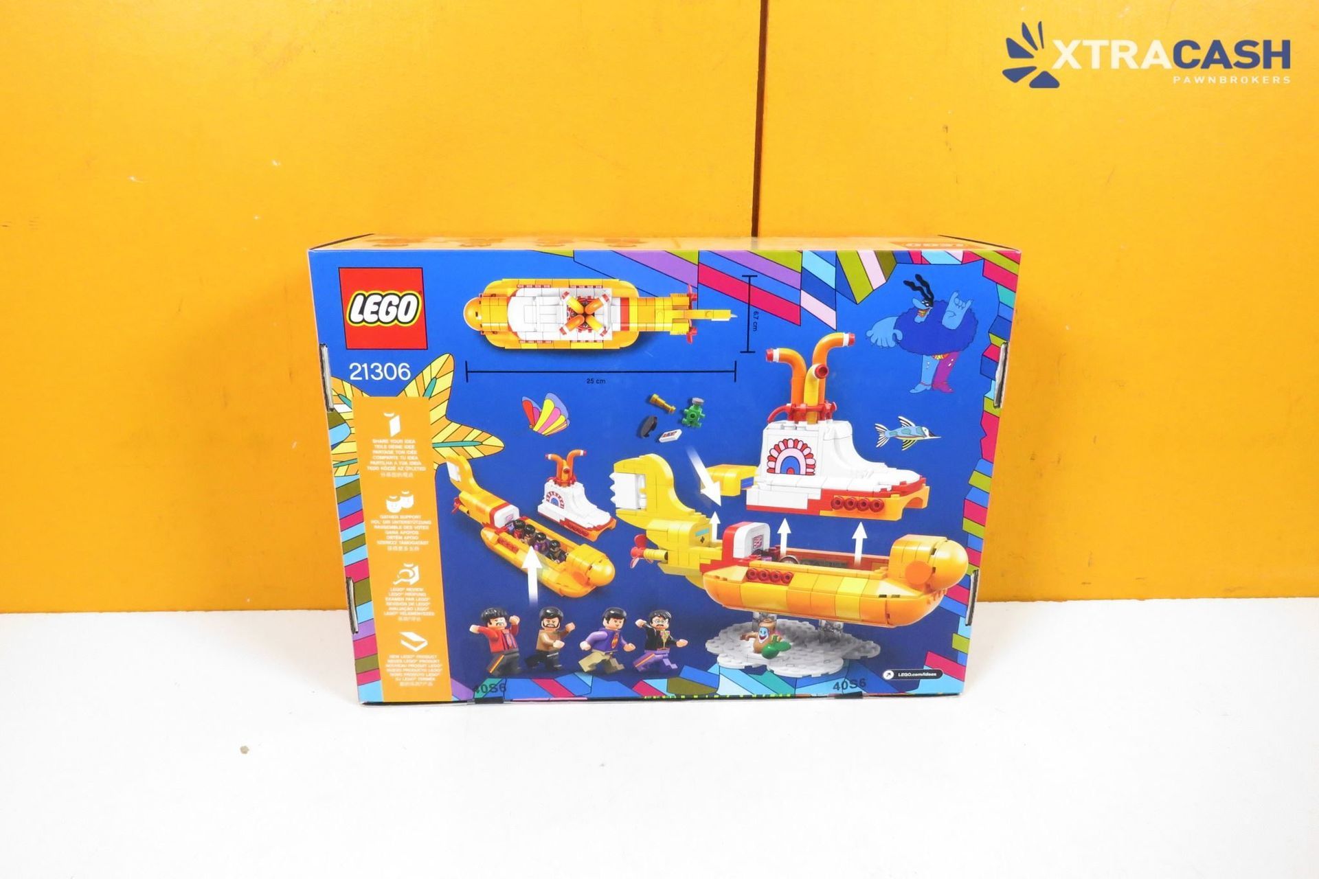 LEGO The Beatles Yellow Submarine set box on a white surface against an orange wall