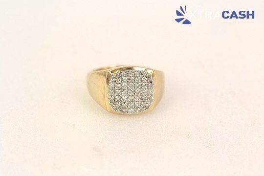 Gold ring with a square cluster of small diamonds on a light background