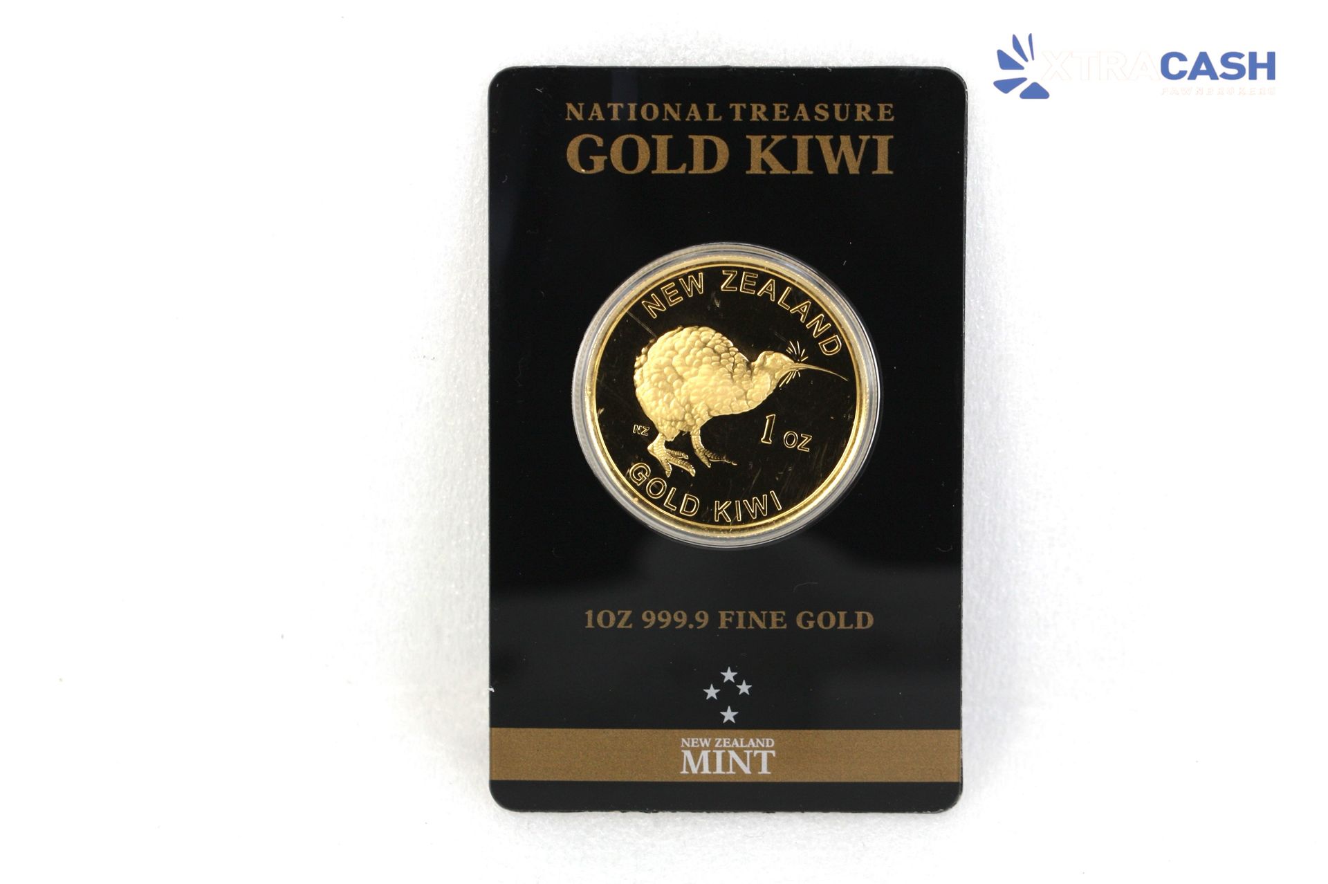 Black gold bar package labeled “PATRON FRANKLIN GOLD KITT” with a gold cat emblem and “CASH” text on white background