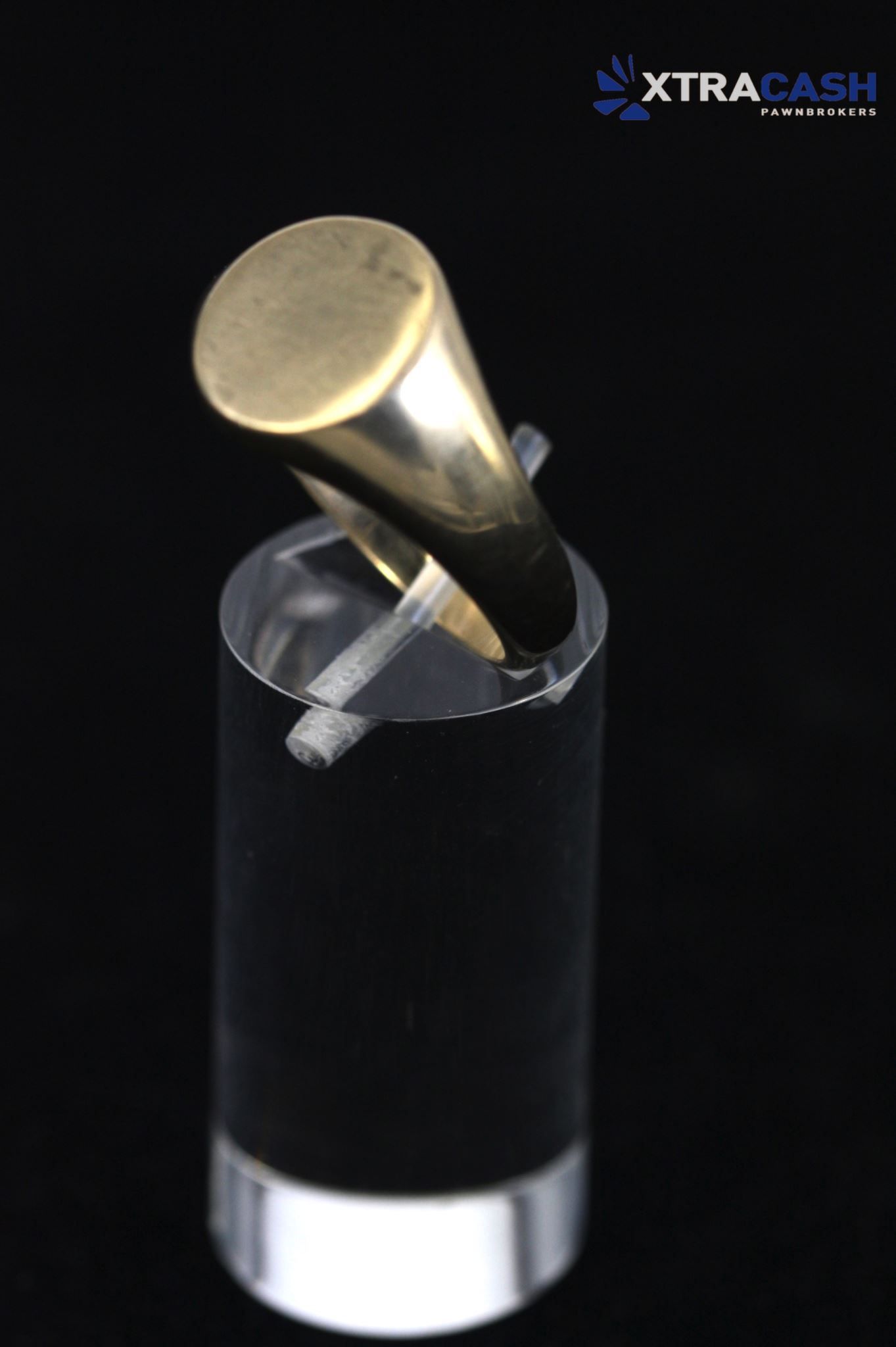 Silver ring with a round bezel on a black background