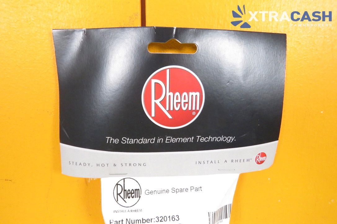 Rheem XtraCash water heater part in clear packaging against a yellow wall