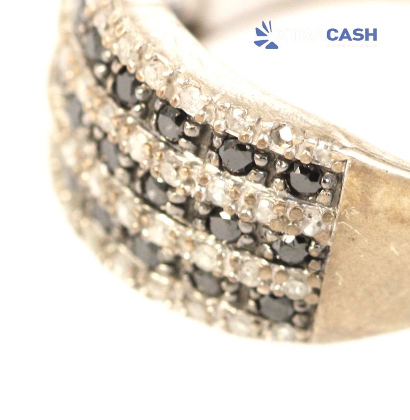 Stacked silver ring with black stones on a white background