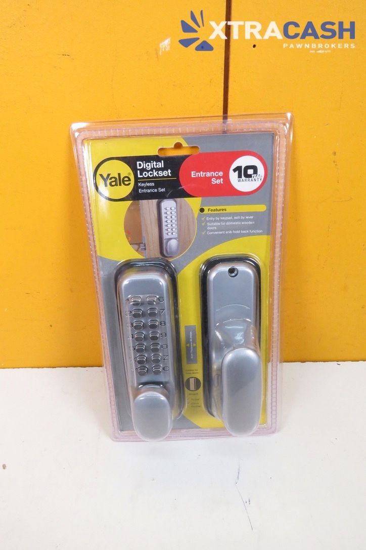 Packaging of a Yale silver digital door lock and handle set on a yellow display card