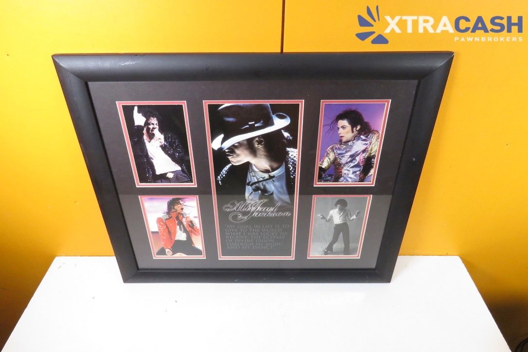 Framed collage of five photos on a white table against a bright yellow wall