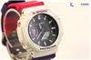 G-SHOCK wristwatch with cream bezel, black face, and pink strap on a white background