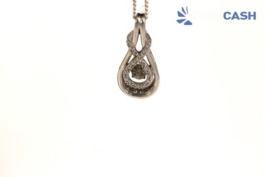 Silver teardrop pendant on a chain against a white background