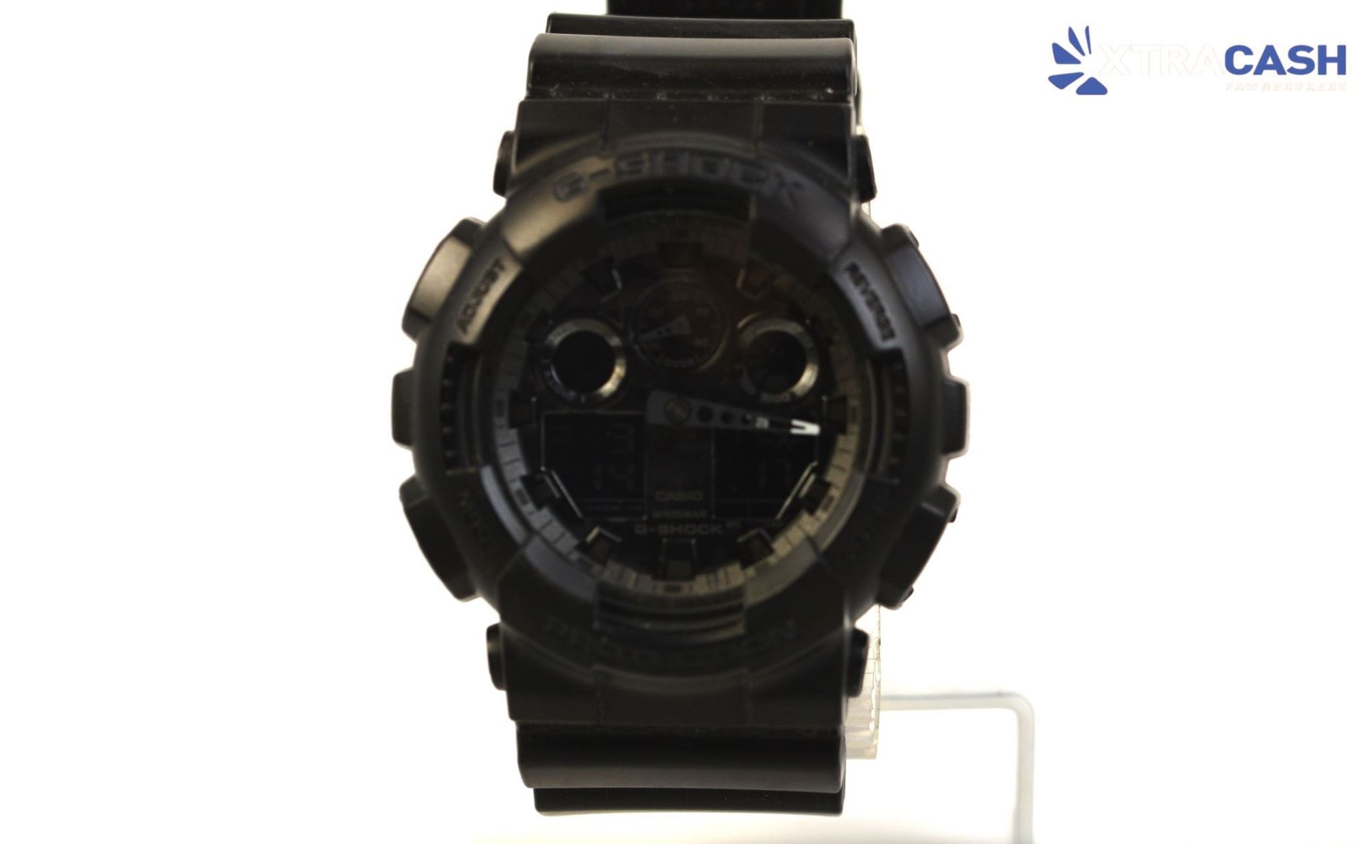 Black digital wristwatch with a clear case and bulky strap on a white background