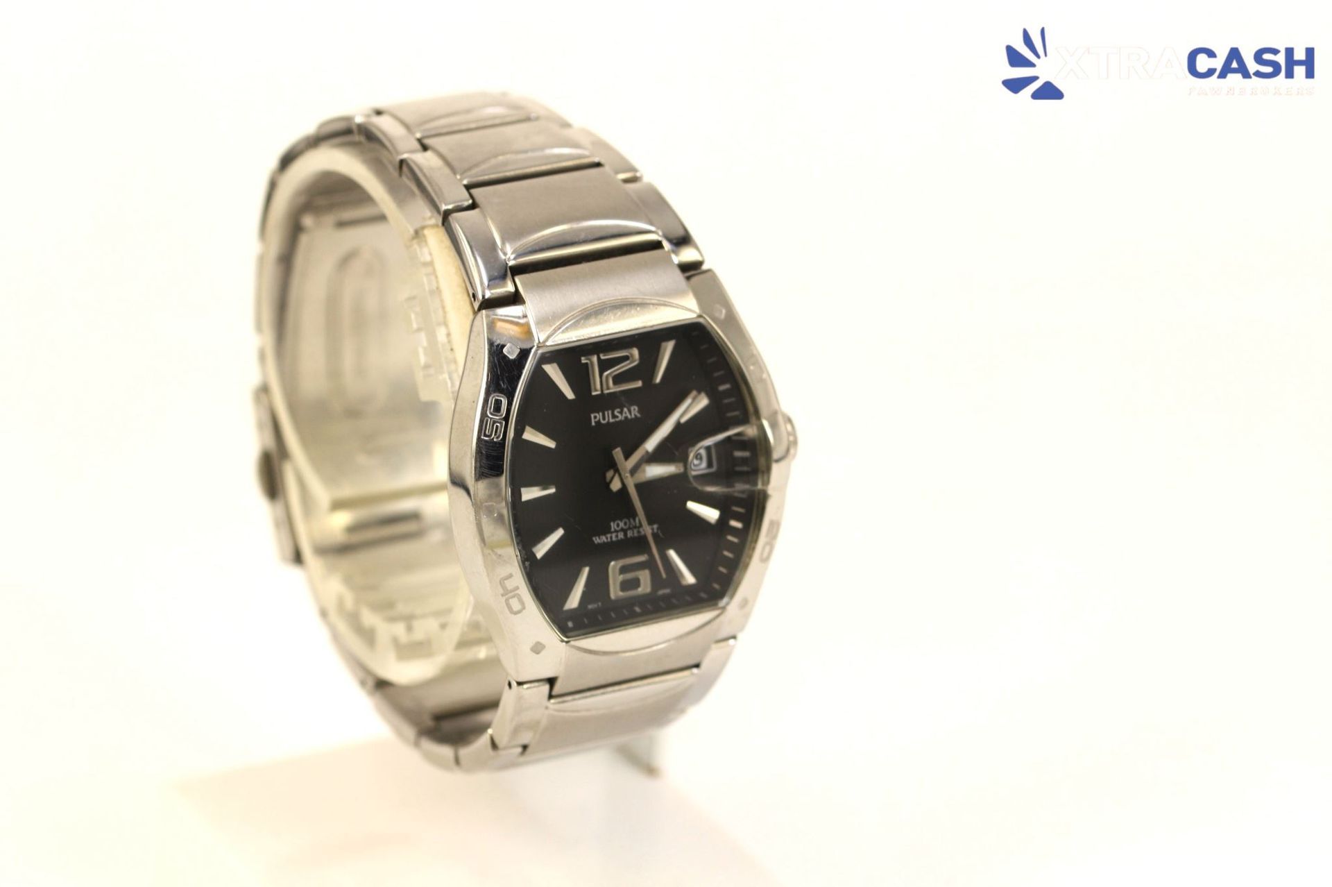 Silver wristwatch with a black dial on a white background