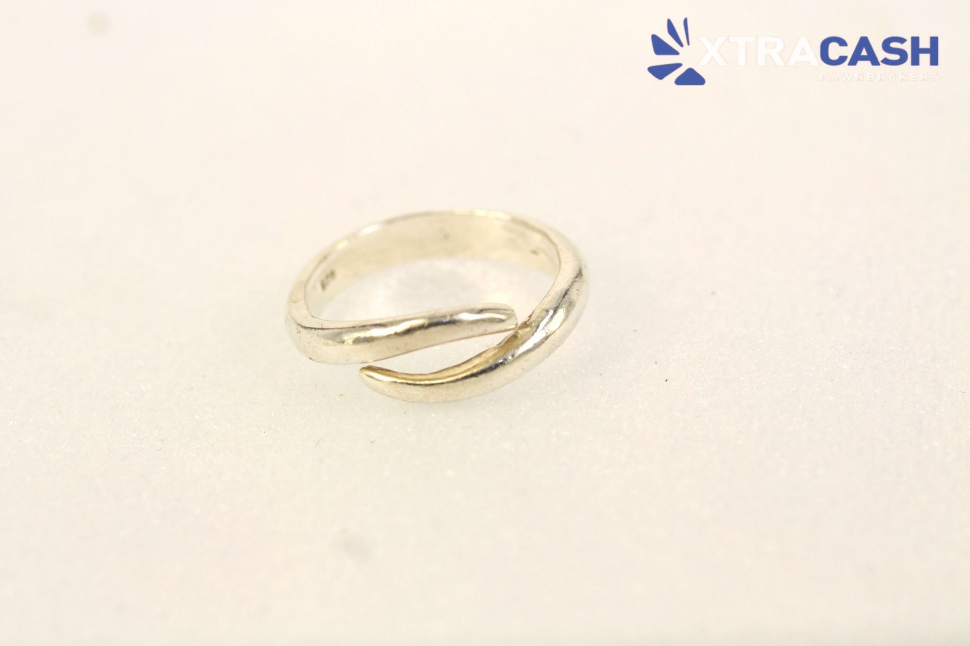 Silver ring on a white background