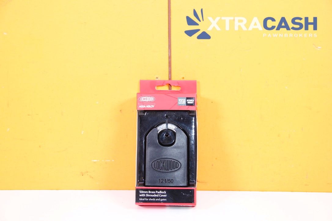 Red and black wall-mounted phone on a yellow wall with XTRACASH logo.