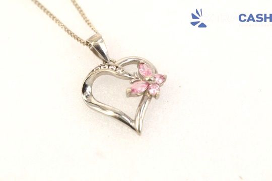 Silver heart pendant necklace with pink flower accents on a white background