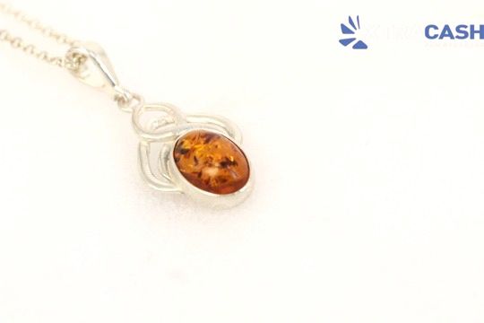 Amber gemstone pendant necklace with three round orange-brown stones on a silver chain