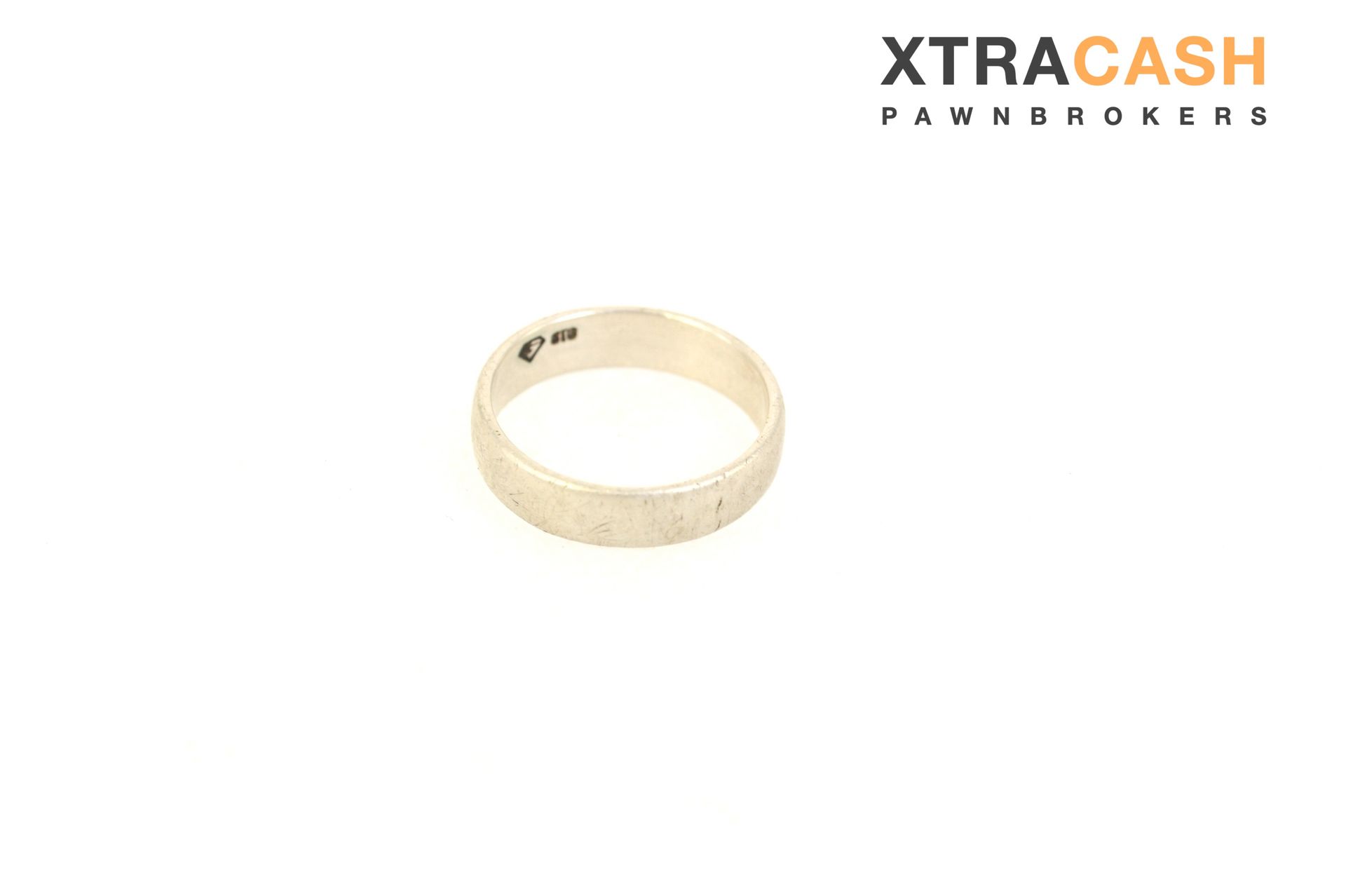 Gold ring on a white background with the XTRACASH Pawnbrokers logo in the top right.