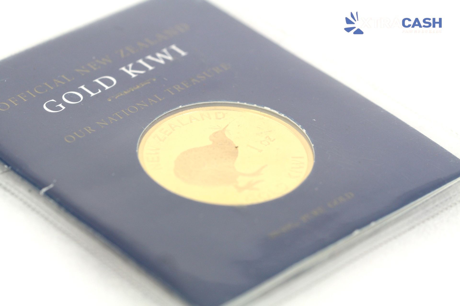 Blue packet labeled “New Zealand Gold Kiwi” with a gold kiwi coin design