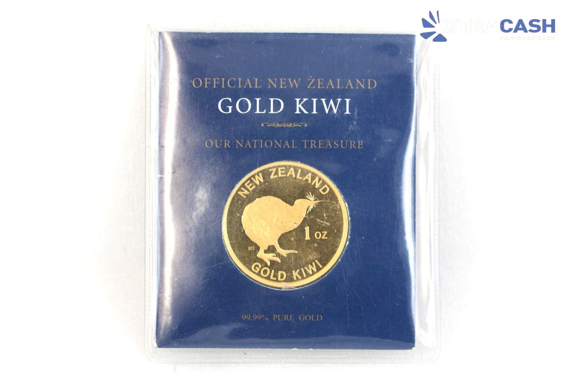 Blue packet labeled “New Zealand Gold Kiwi” with a gold kiwi coin design