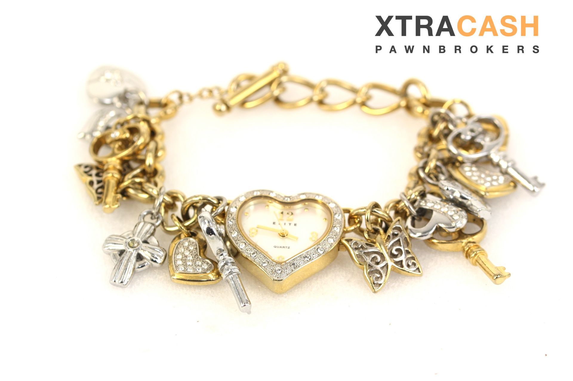Gold and silver charm bracelet with a heart centerpiece on a white background