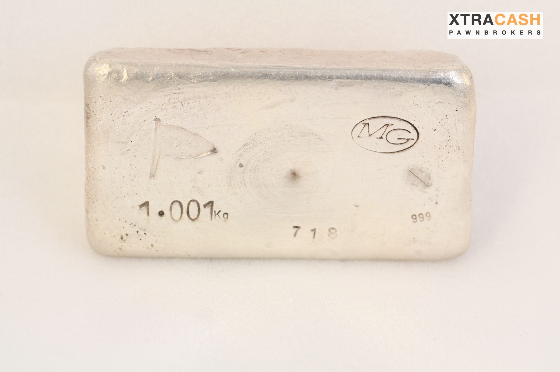 Rectangular silver bullion bar on a white background