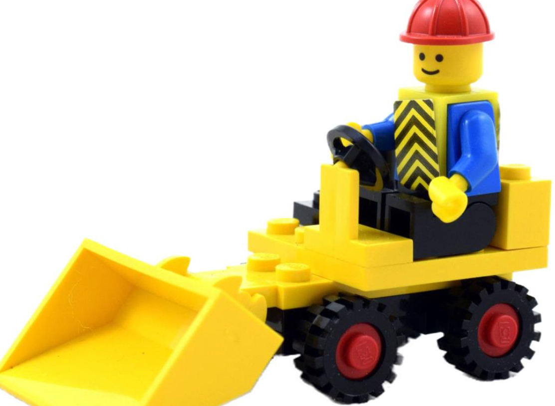 LEGO worker driving a yellow construction loader with a red hard hat and black wheels