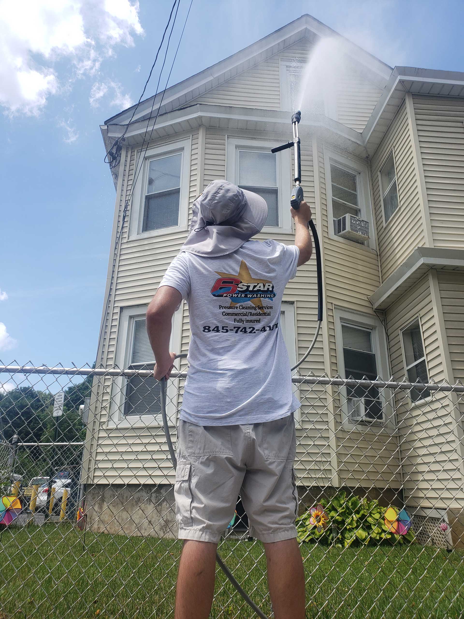 Professional Worker Cleaning Sidings