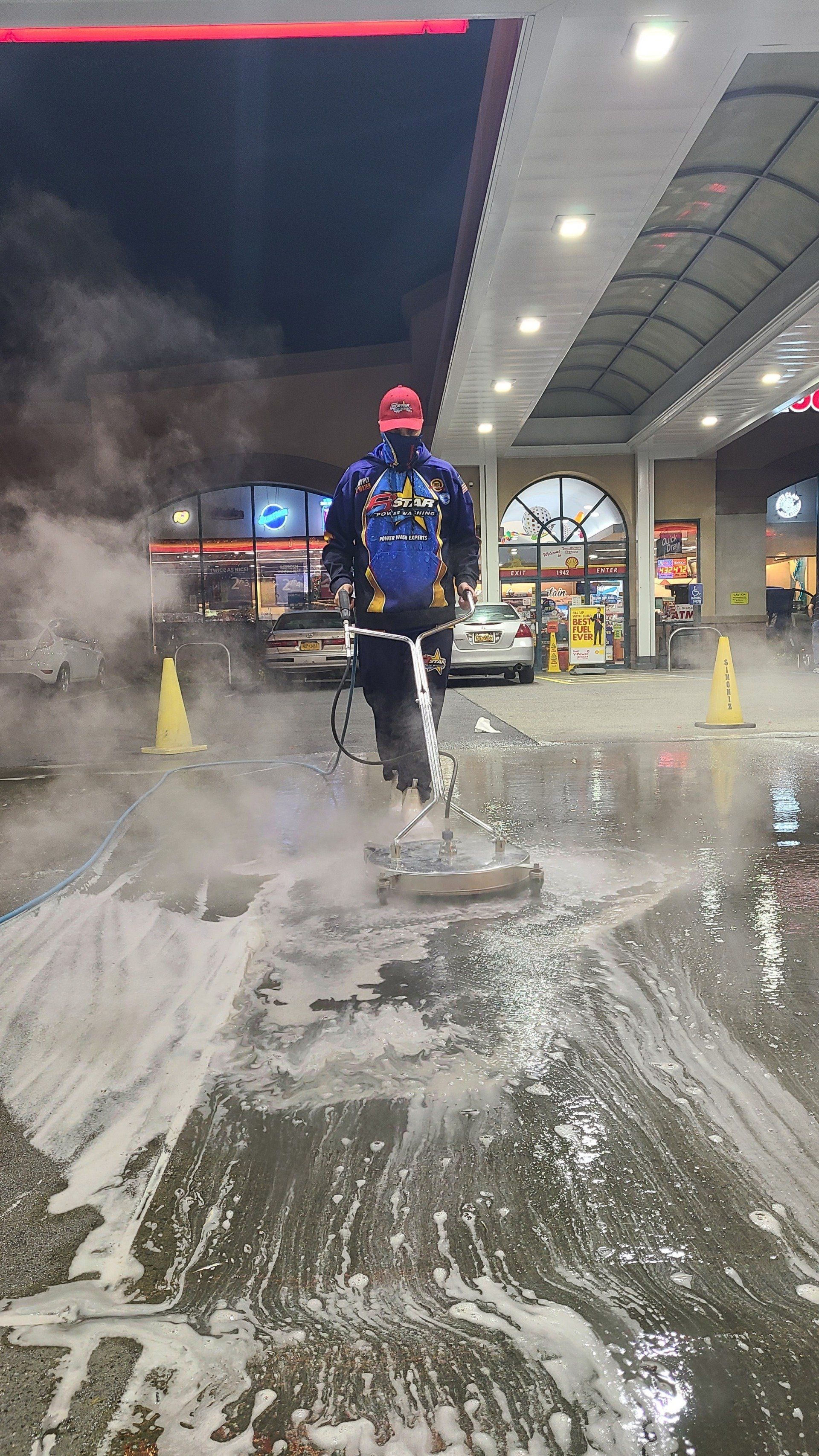 Person Power Washing Ground