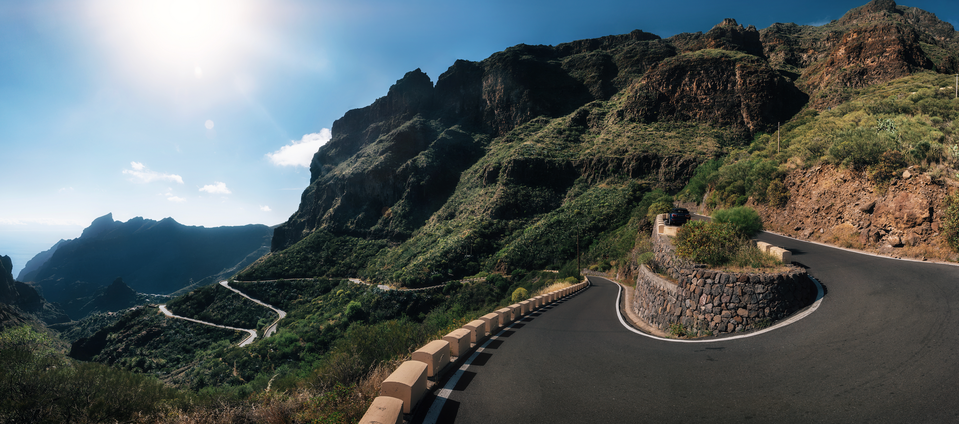 A winding road going through a mountainous area.