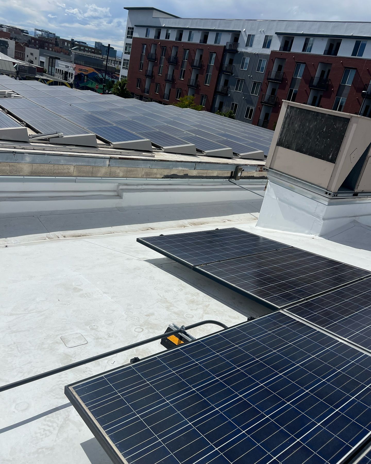 A roof with a lot of solar panels on it