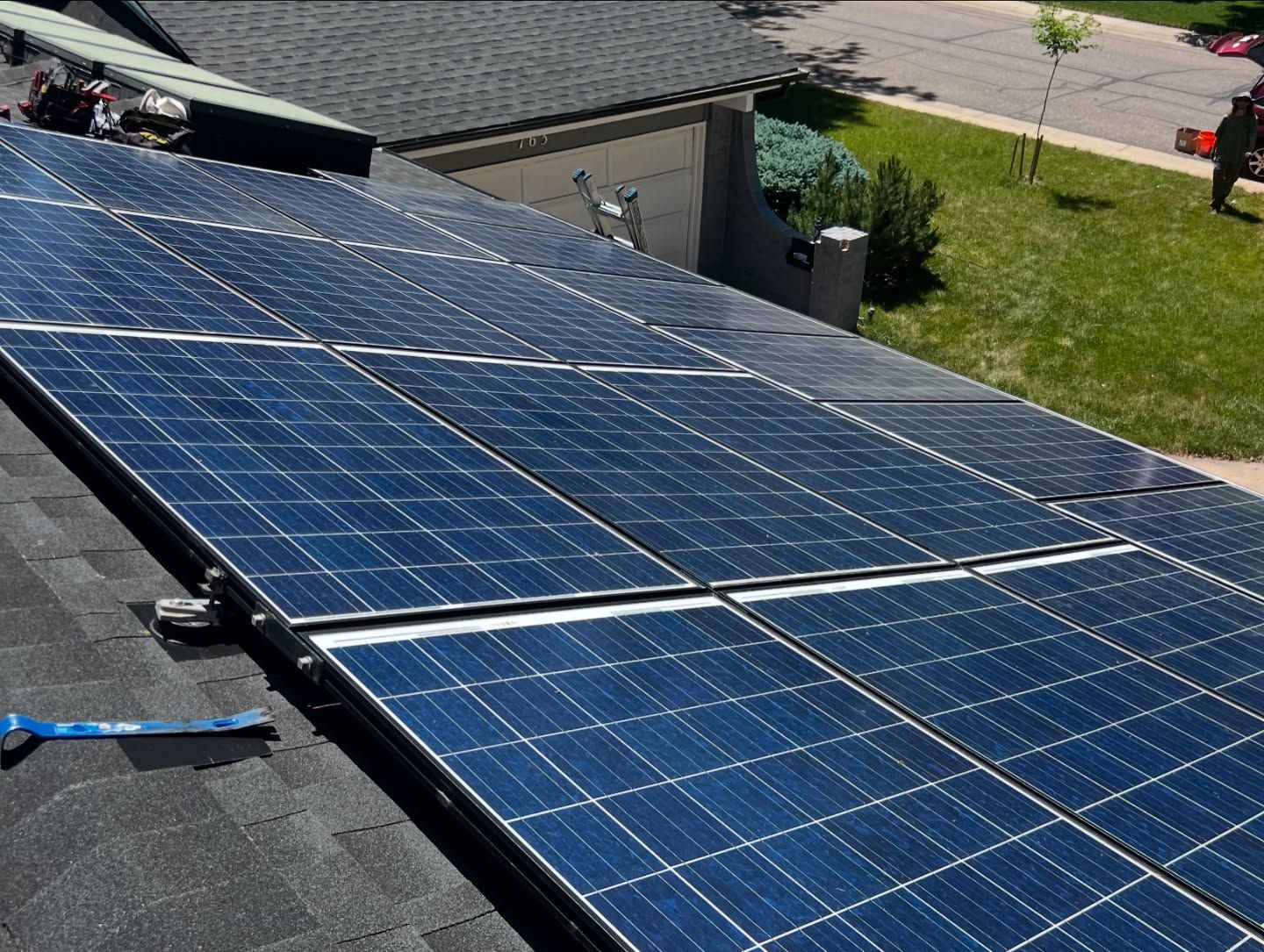 A row of solar panels on the roof of a house