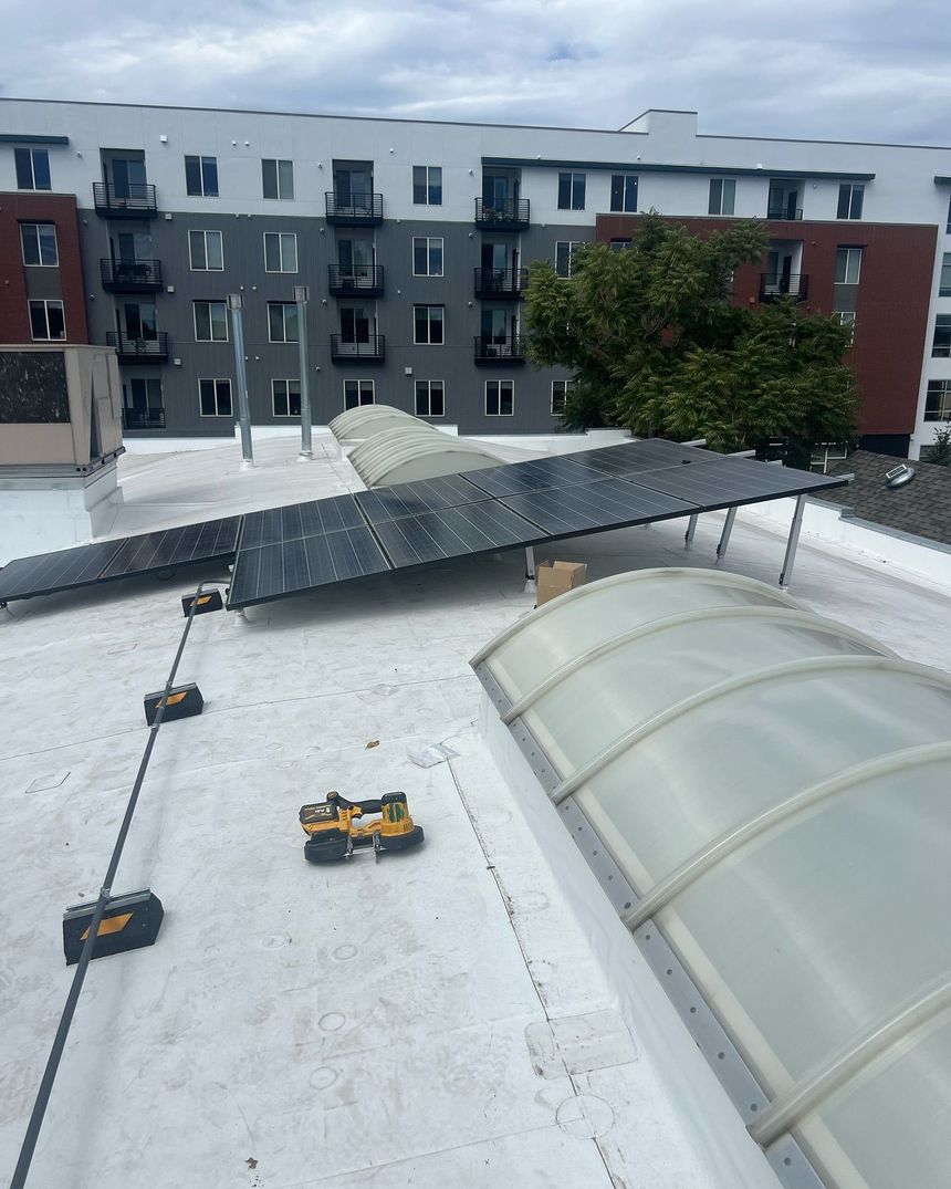 A roof with solar panels and a dome on it