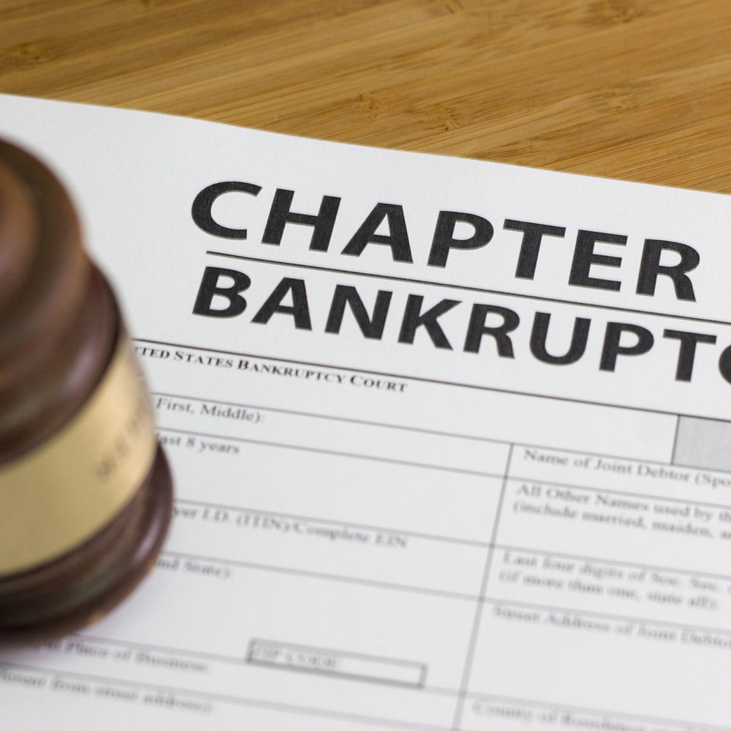 Chapter bankruptcy form with a gavel on a wooden desk
