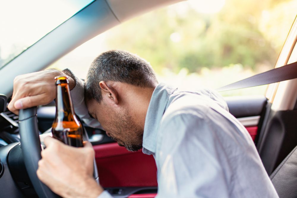 Man With Alcohol Who Is Drink Driving - Cairns Traffic Lawyers, Cairns QLD