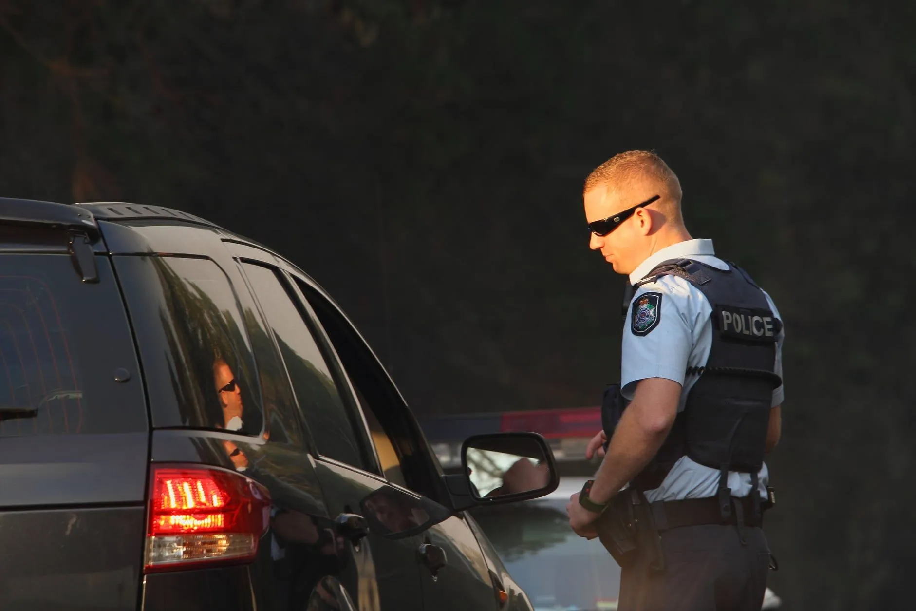 Police Officer Talking To A Driver During A Roadside Stop — Cairns Traffic Lawyers In Brinsmead, QLD