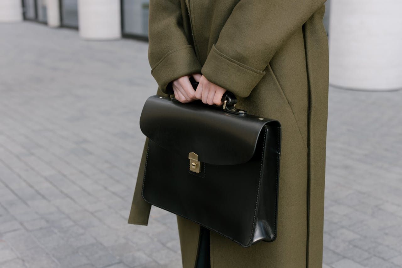 Woman In Overcoat Holding Briefcase - Cairns Traffic Lawyers, Cairns QLD