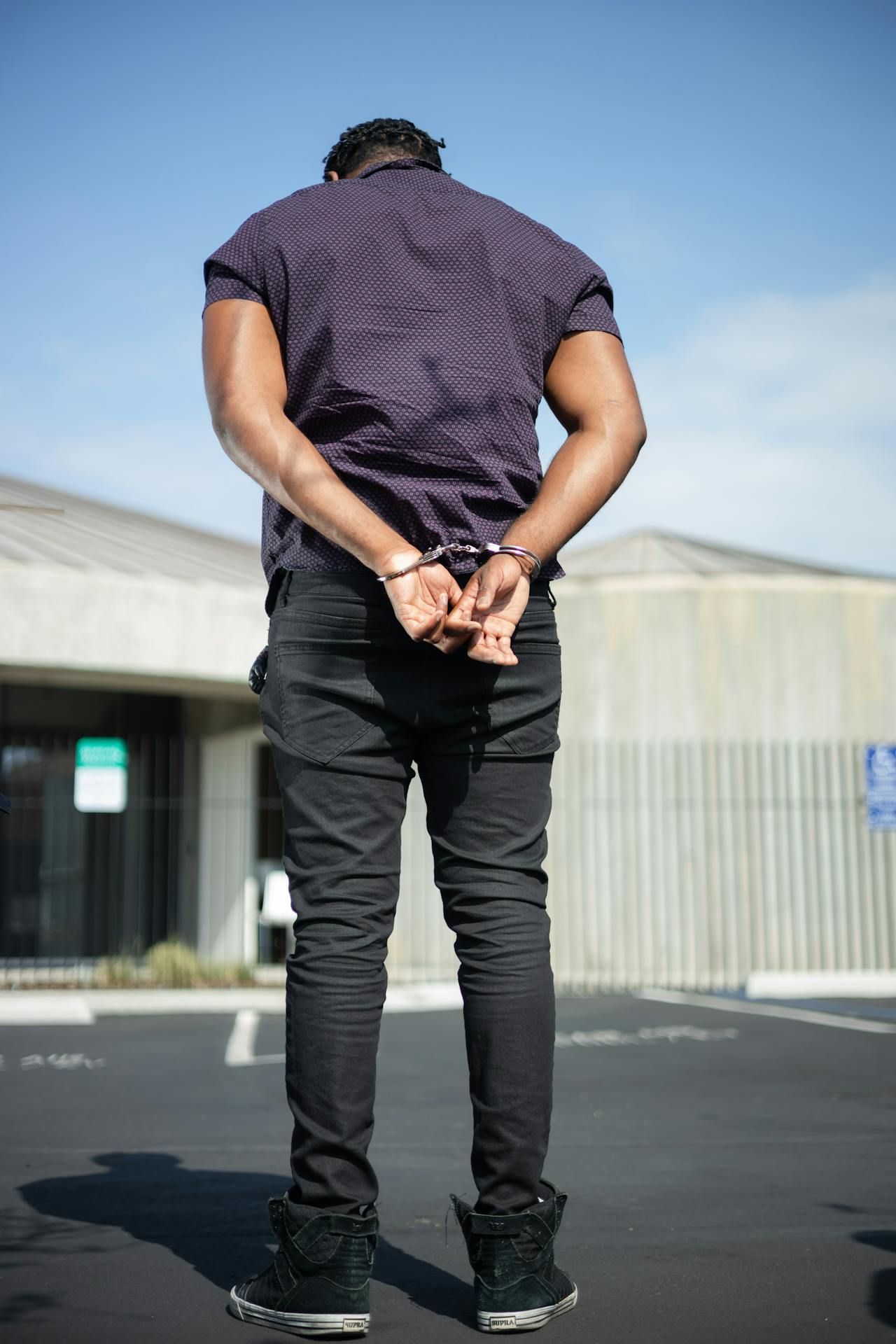 Rear View Of Man Arrested In Handcuffs - Cairns Traffic Lawyers In Cairns QLD